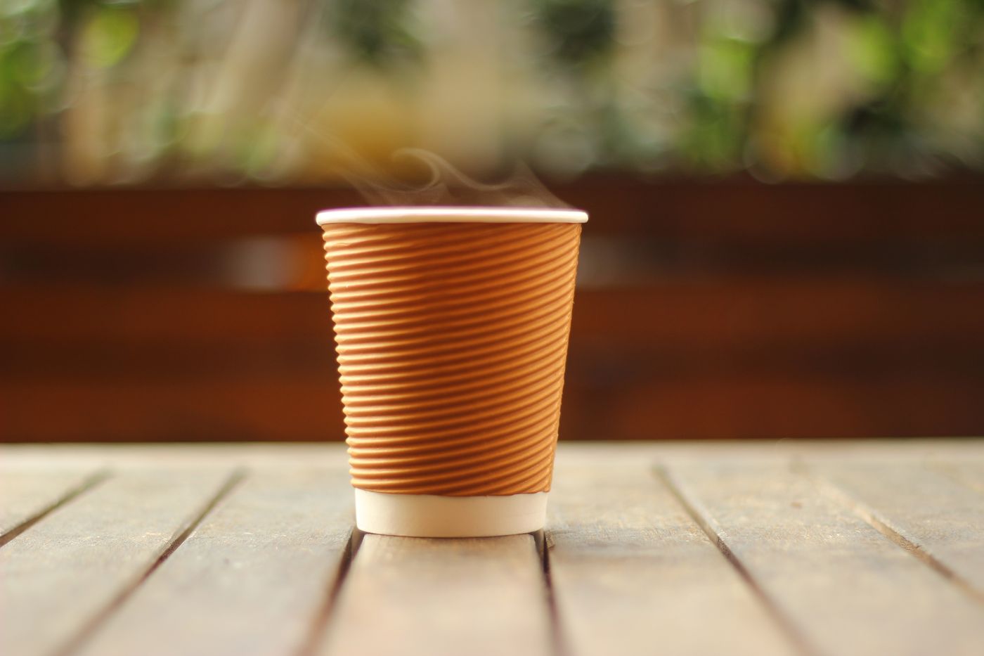 A cup of coffee on a wooden table