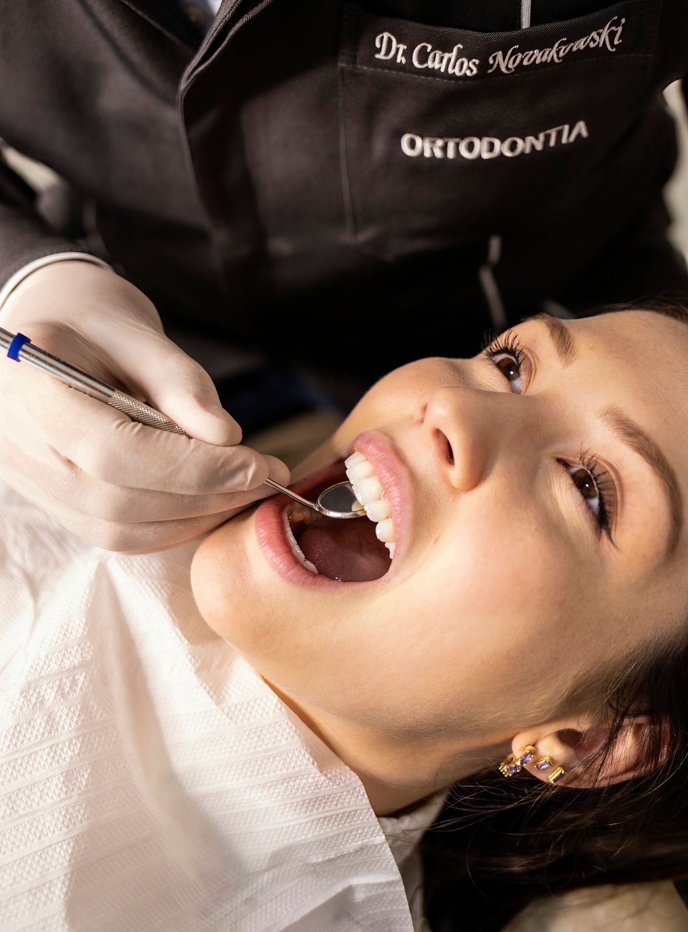 A woman having her teeth examined at a dental appointment