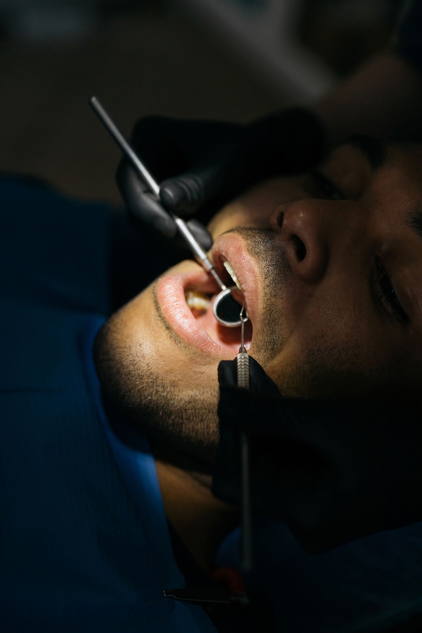 A dental examination using a mouth mirror and probe