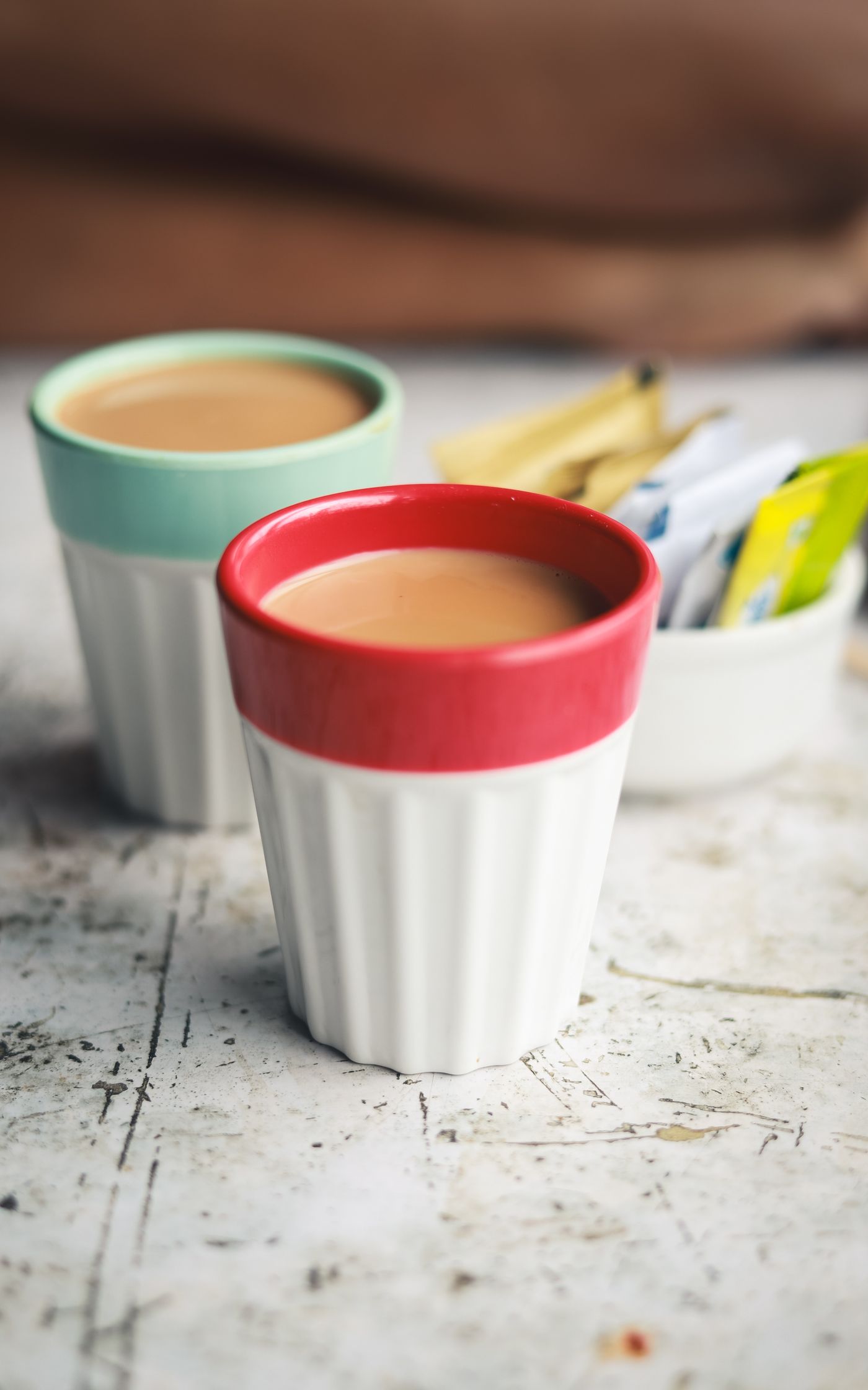 Ceramic cups of tea on a rustic surface