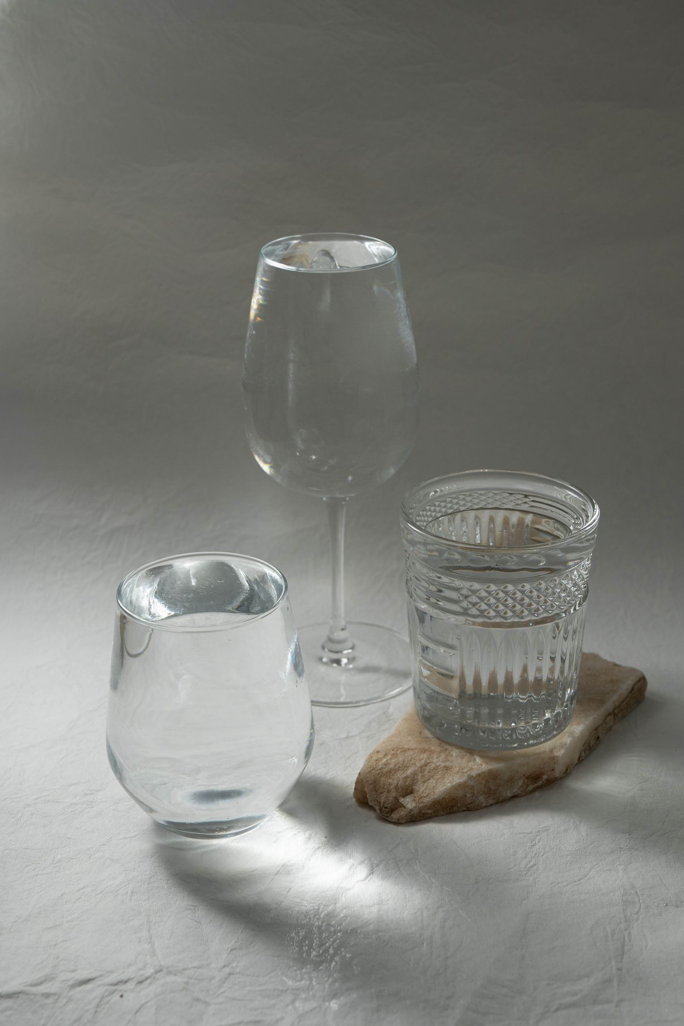 Plain glasses of water arranged on a table